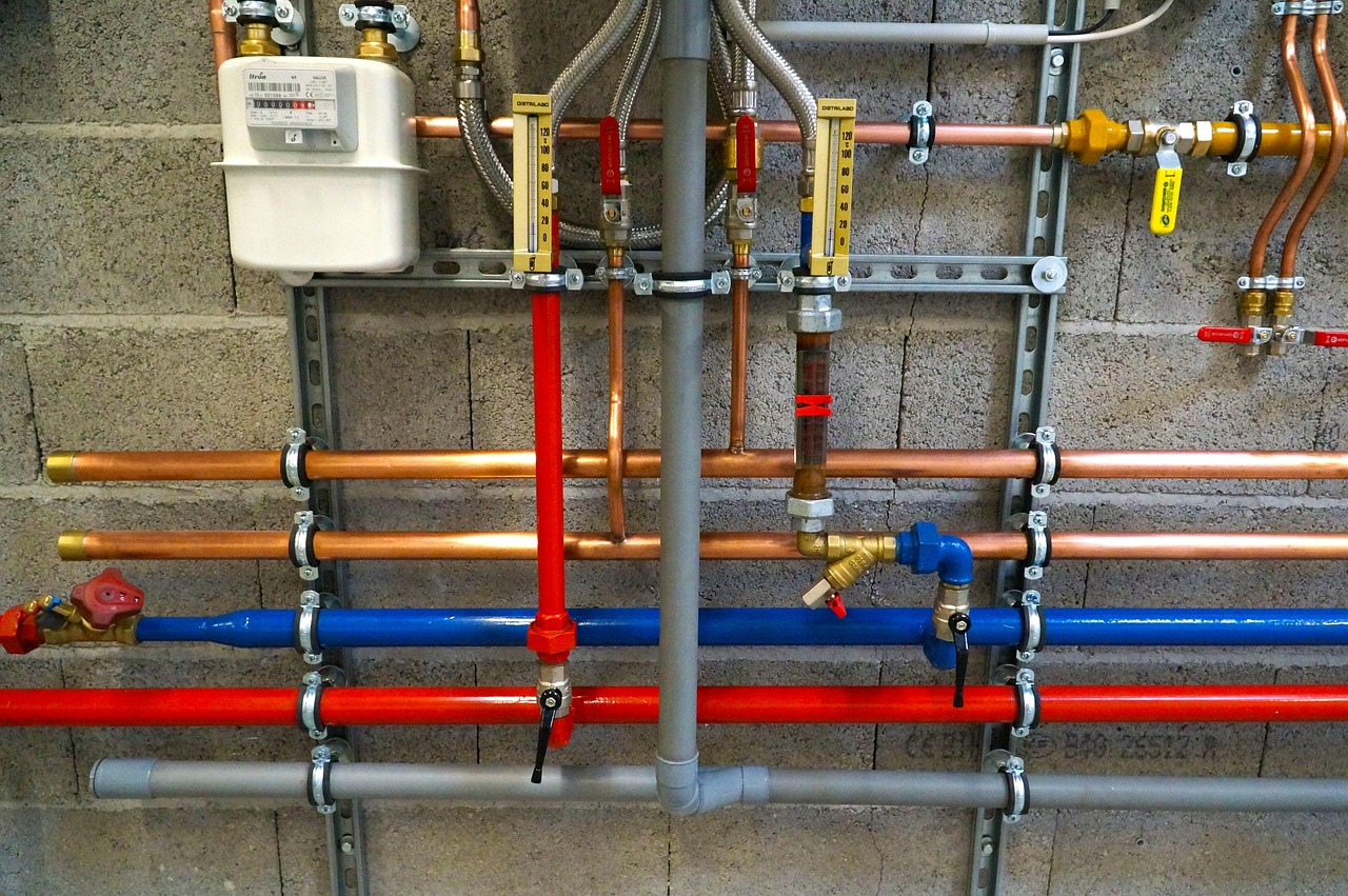 Copper and PEX water lines on a wall manifold